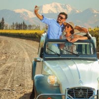 Classic car in the vineyards of Mendoza Argentina Gov Contours Travel