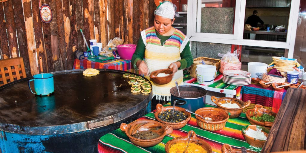 Lady in Mexican kitchen food culinary Mexico Condor Verde shutterstock 360094688 Contours Travel
