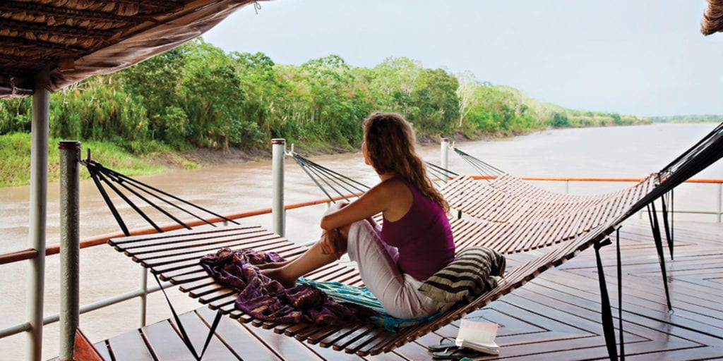 Relaxing Hammock on deck Amazon River Iquitos Peru Delfin Cruise Contours Travel