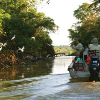 Skiff through amazon river activities Iquitos Peru Delfin Cruise Contours Travel