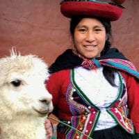 Woman with llama in the streets of Cuzco Peru Diego Curutchet Contours Travel