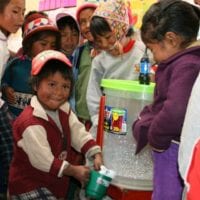 Contours Travel Agua Pura community project. Water filter donation recipient in Sacred Valley